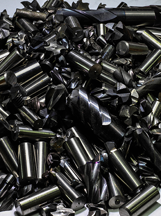 Scrap carbide endmills in pile